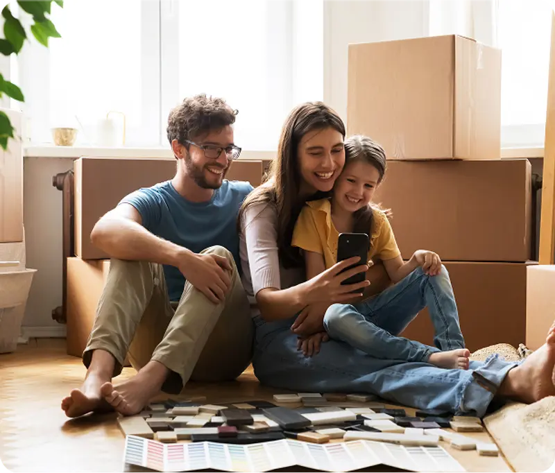 People using laptop while packaging items