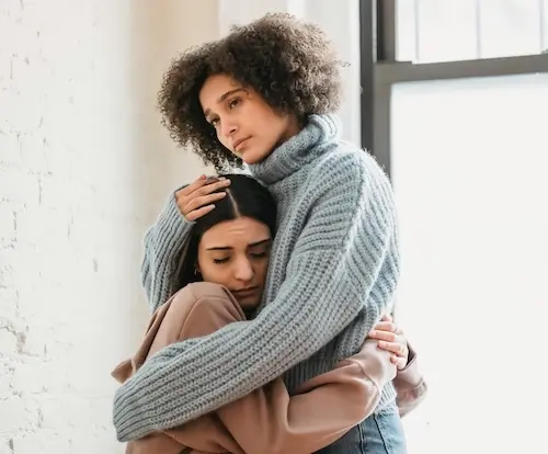 Two people hugging